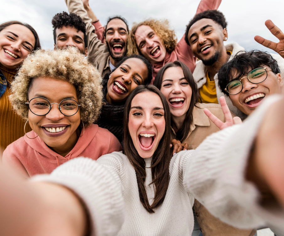 diverse people laughing and making selfie