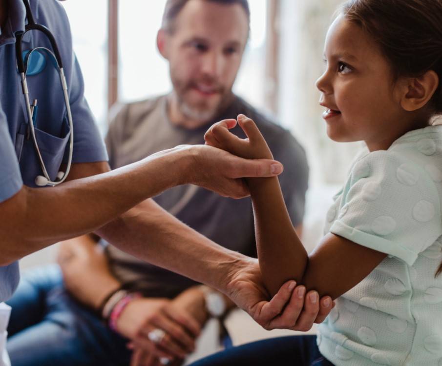 girl with father at doctors